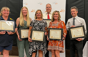  Falcon Zone team members are honored at the Fantastic 49 celebration.